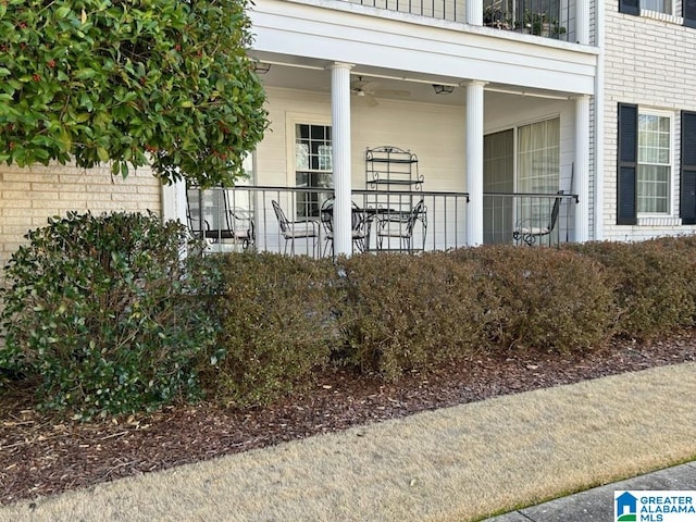 view of exterior entry featuring ceiling fan