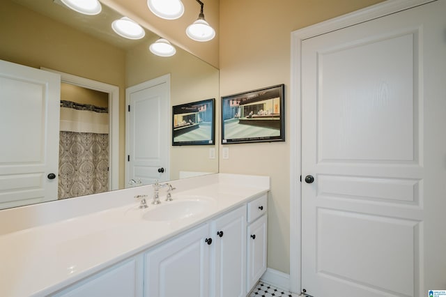 bathroom featuring tile patterned flooring, vanity, and a shower with shower curtain