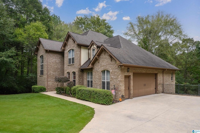 view of front of home with a garage and a front yard