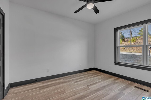 1164 Ranch Marina Rd, Pell City, AL 35128 - unfurnished room with light wood-style floors, ceiling fan, and baseboards