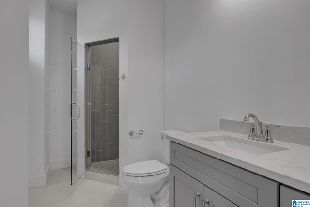 full bath featuring toilet, tile patterned floors, a shower stall, and vanity