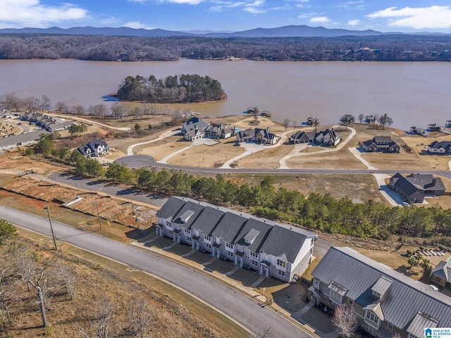 drone / aerial view with a residential view and a water and mountain view