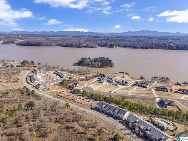 aerial view featuring a water and mountain view