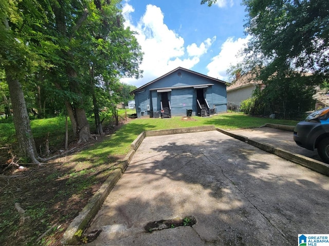 bungalow-style home with a front yard