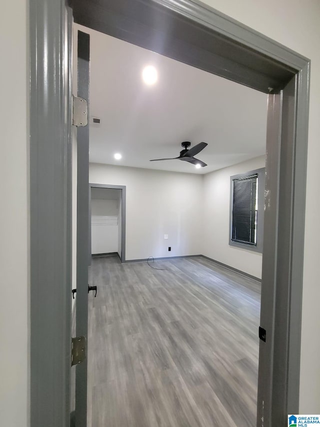 empty room featuring hardwood / wood-style flooring and ceiling fan