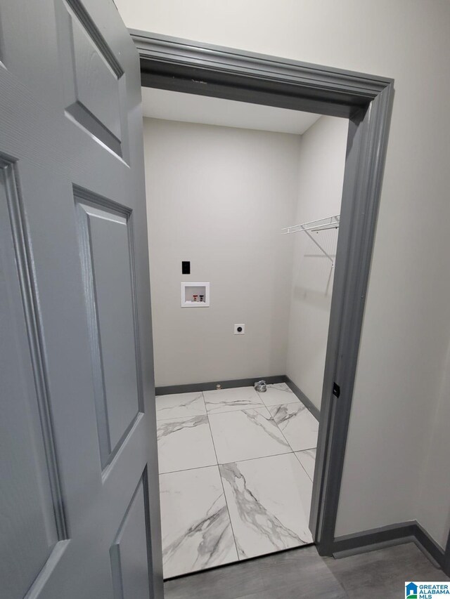 1607 3rd Ave W, West Jefferson, AL 35208 - clothes washing area with washer hookup, baseboards, electric dryer hookup, and light marble finish floors