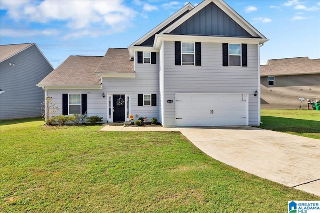 view of front of home with a garage and a front lawn