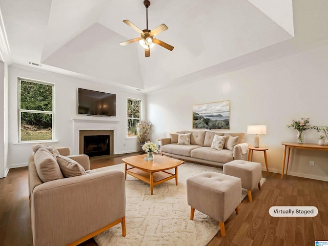 living room with ceiling fan, high vaulted ceiling, and wood-type flooring