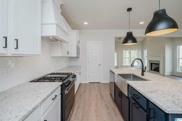 194 Barimore Blvd, Helena, AL 35080 - kitchen with stainless steel appliances, custom exhaust hood, white cabinets, open floor plan, and backsplash