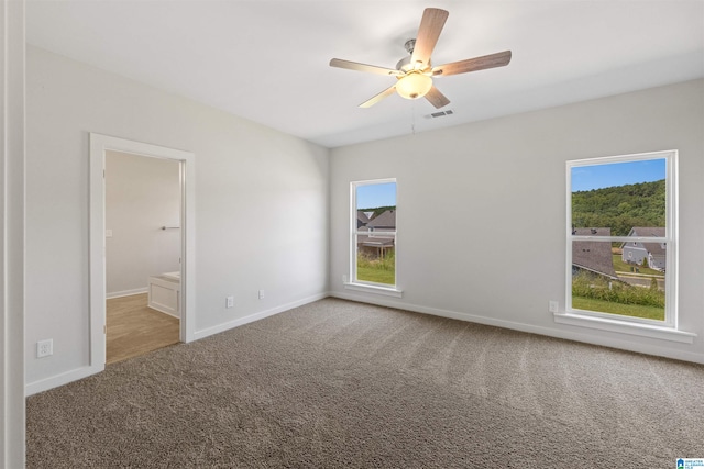 interior space featuring ceiling fan