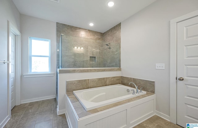 bathroom with independent shower and bath