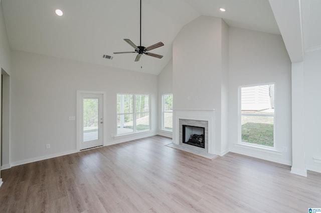 194 Barimore Blvd, Helena, AL 35080 - unfurnished living room featuring high vaulted ceiling, plenty of natural light, a fireplace, wood finished floors, and ceiling fan
