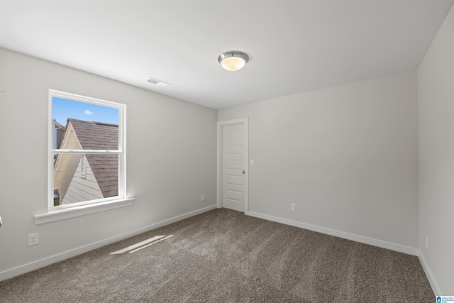 view of carpeted spare room