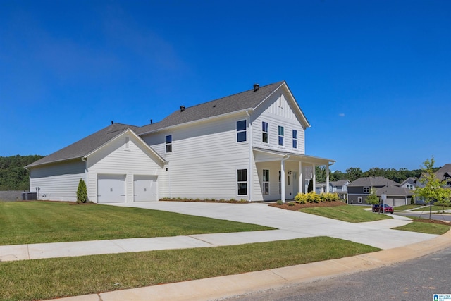 view of front of property featuring central air condition unit, a front yard, covered porch, and a garage