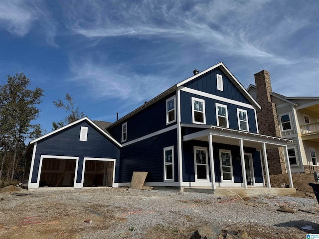 view of front facade featuring a garage and covered porch