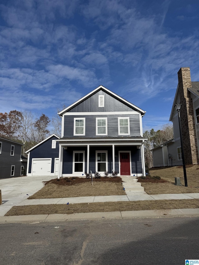 view of front of property with a porch and a garage