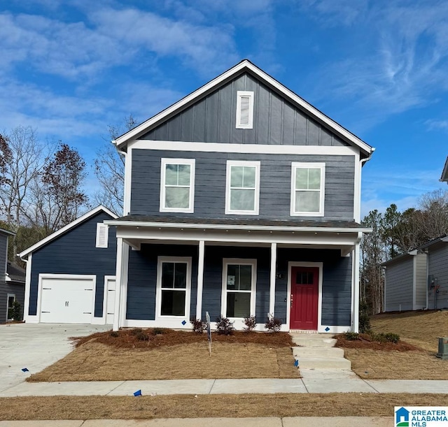 view of front of house with covered porch and a garage