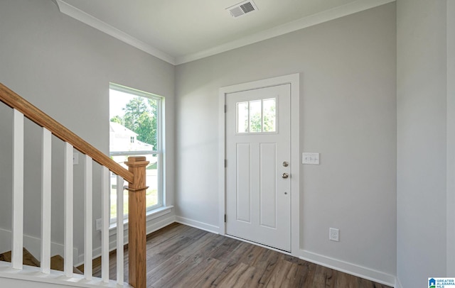 entrance foyer with crown molding and dark hardwood / wood-style floors