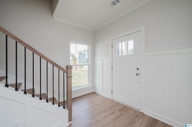 194 Barimore Blvd, Helena, AL 35080 - entrance foyer featuring light wood-type flooring, a decorative wall, a wainscoted wall, stairs, and crown molding
