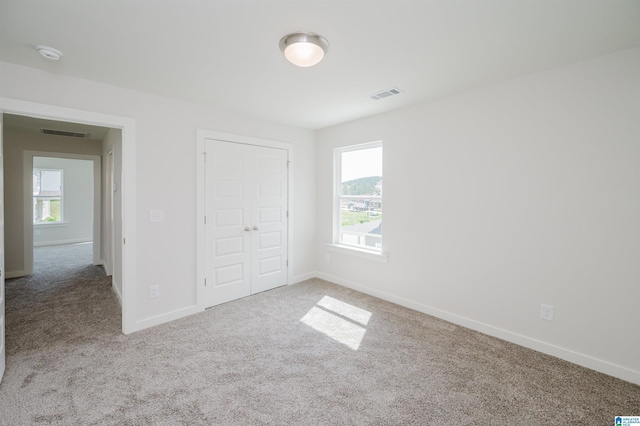 194 Barimore Blvd, Helena, AL 35080 - unfurnished bedroom featuring carpet flooring, multiple windows, and a closet