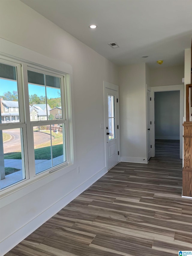 unfurnished room featuring dark hardwood / wood-style flooring