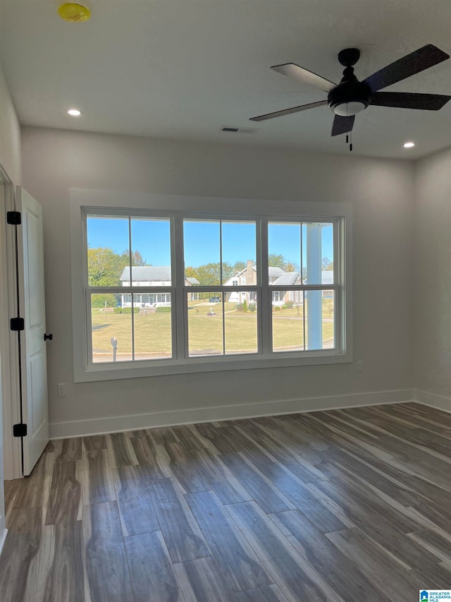 unfurnished room featuring ceiling fan and hardwood / wood-style flooring