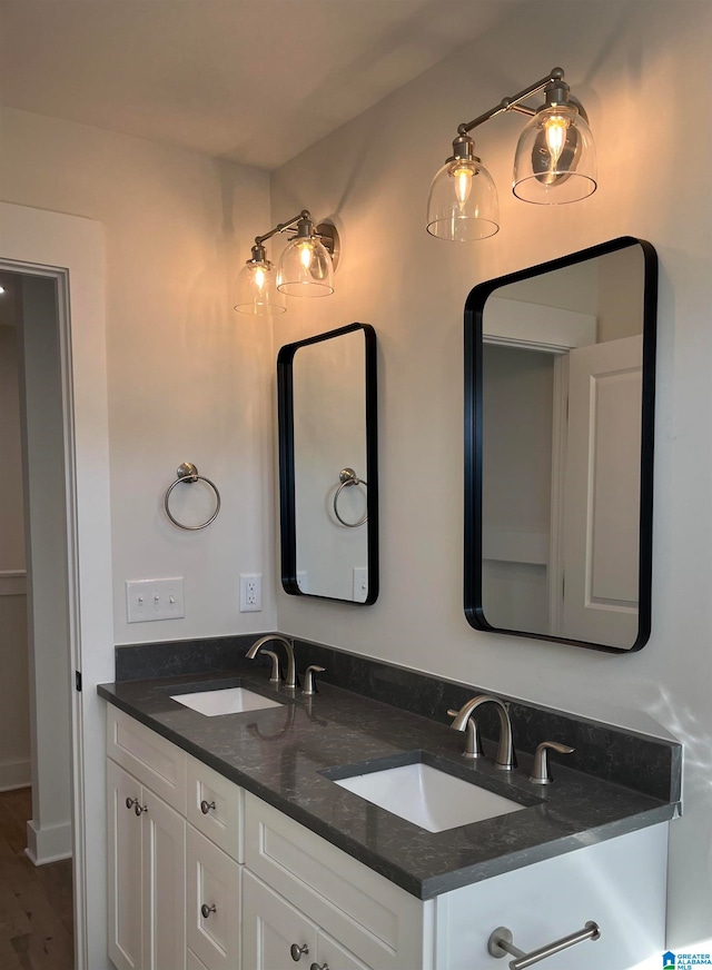 bathroom featuring vanity and wood-type flooring