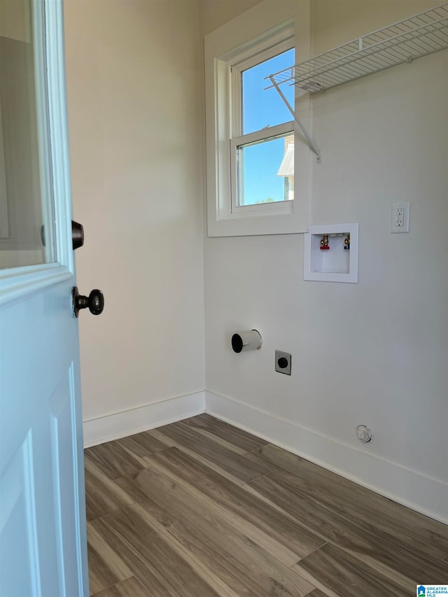 clothes washing area with washer hookup, electric dryer hookup, wood-type flooring, and gas dryer hookup