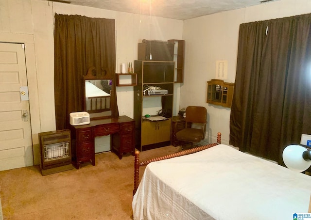 bedroom featuring a textured ceiling and light colored carpet