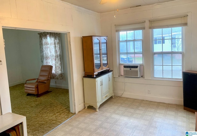 1304 2nd Ave N, Clanton, AL 35045 - interior space with cooling unit, light carpet, baseboards, and ceiling fan