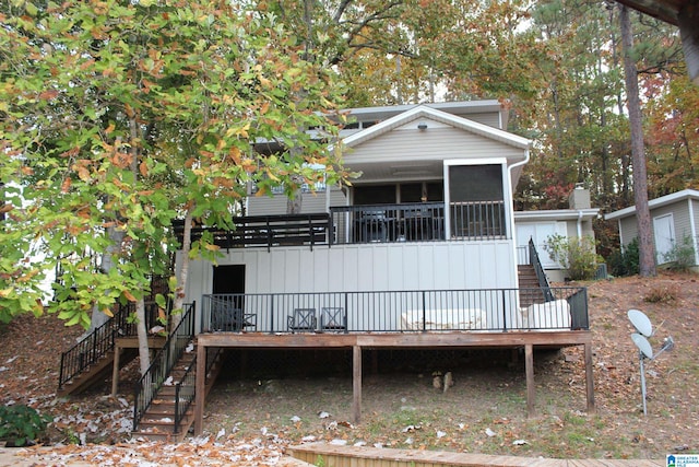 back of house with stairway and a wooden deck