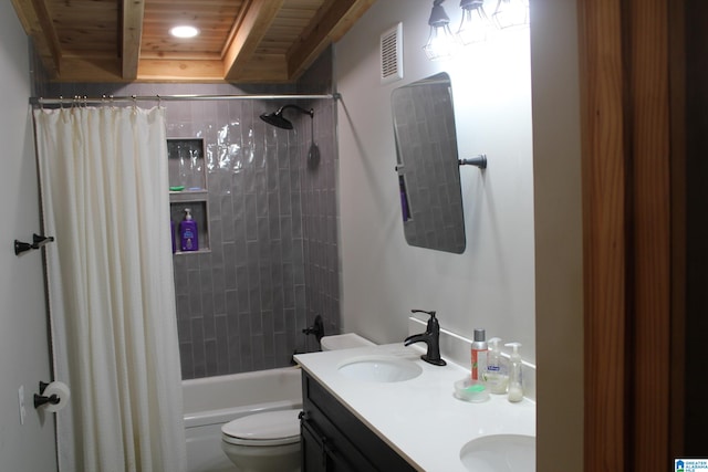 full bathroom with vanity, shower / tub combo with curtain, toilet, and a raised ceiling