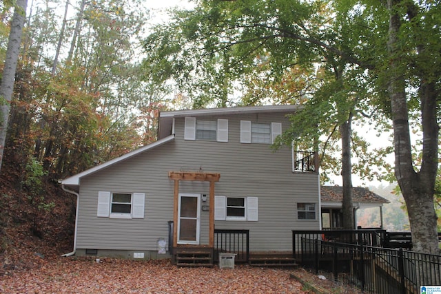 view of front of house with entry steps, crawl space, and a deck