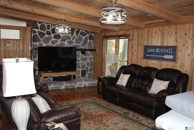 living room featuring wooden ceiling, hardwood / wood-style flooring, beamed ceiling, and wooden walls