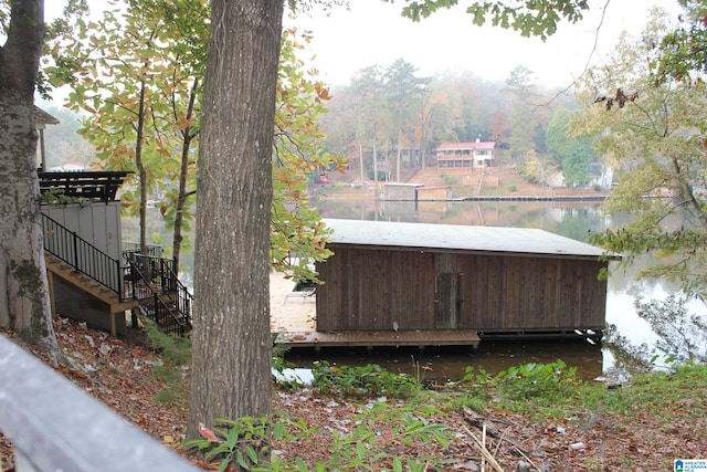 exterior space featuring stairway and a water view