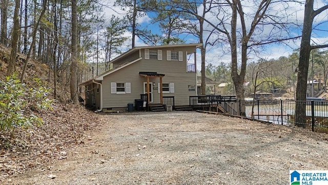 view of front of home featuring fence
