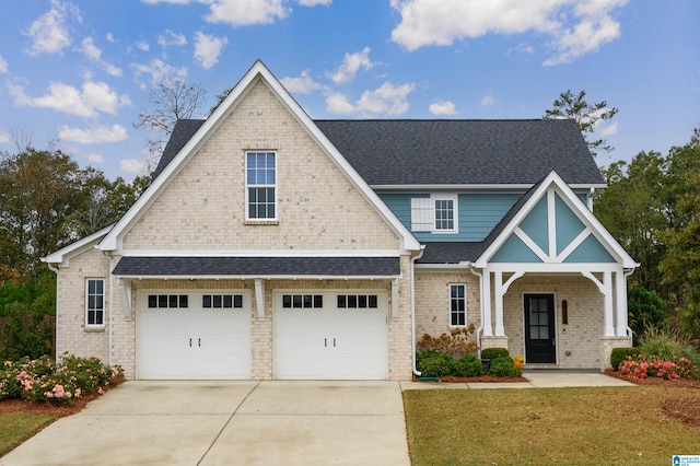 craftsman inspired home featuring a porch, a front lawn, and a garage