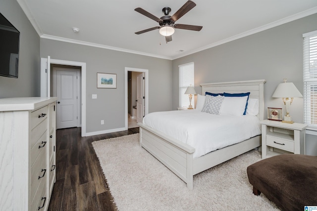 bedroom with ornamental molding, multiple windows, dark hardwood / wood-style floors, and ceiling fan