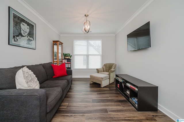 living room featuring dark wood-type flooring, ornamental molding, and a chandelier