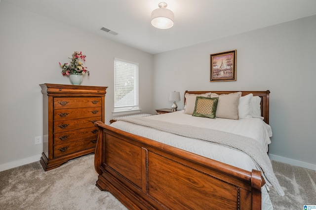 bedroom with light colored carpet