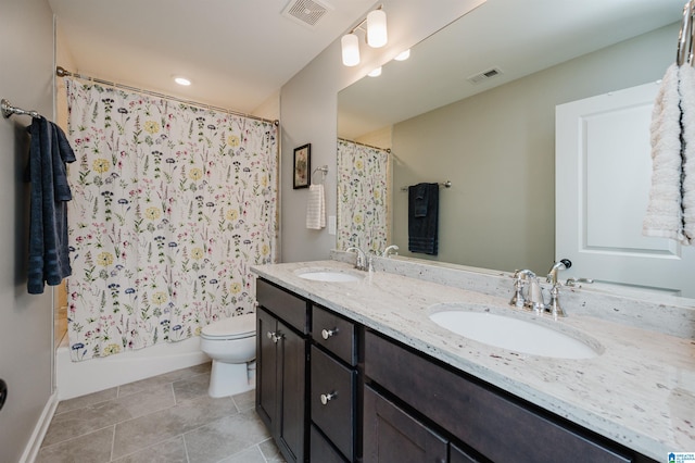 full bathroom with vanity, shower / tub combo with curtain, toilet, and tile patterned floors