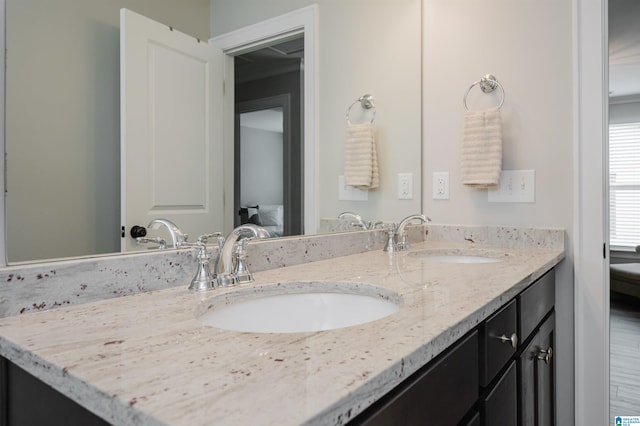 bathroom featuring vanity and hardwood / wood-style floors