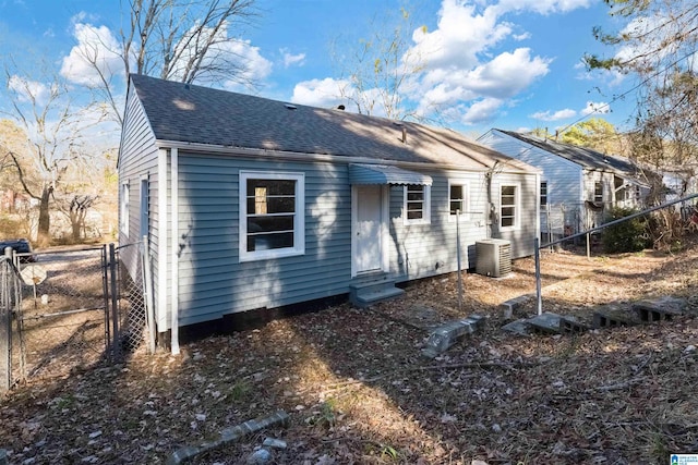 rear view of house with central AC