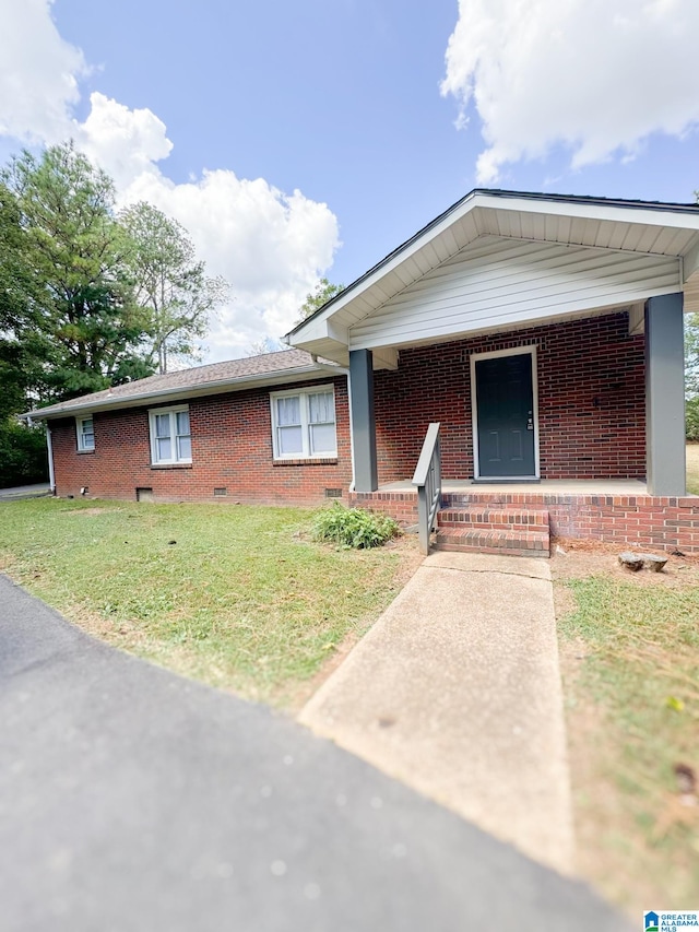 view of front of property with a front yard and a porch