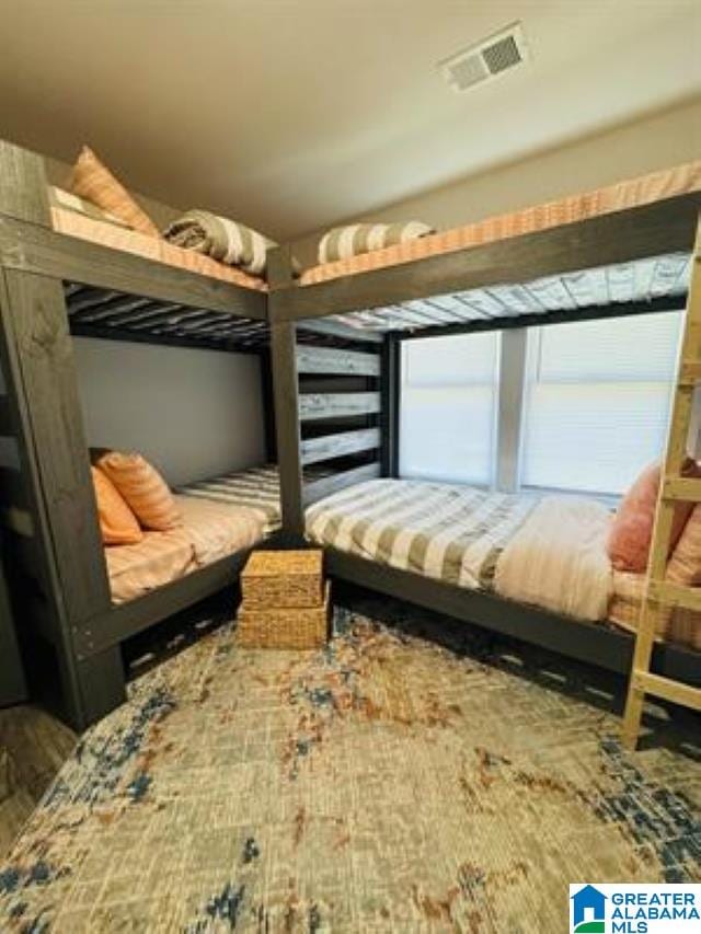 bedroom with wood-type flooring