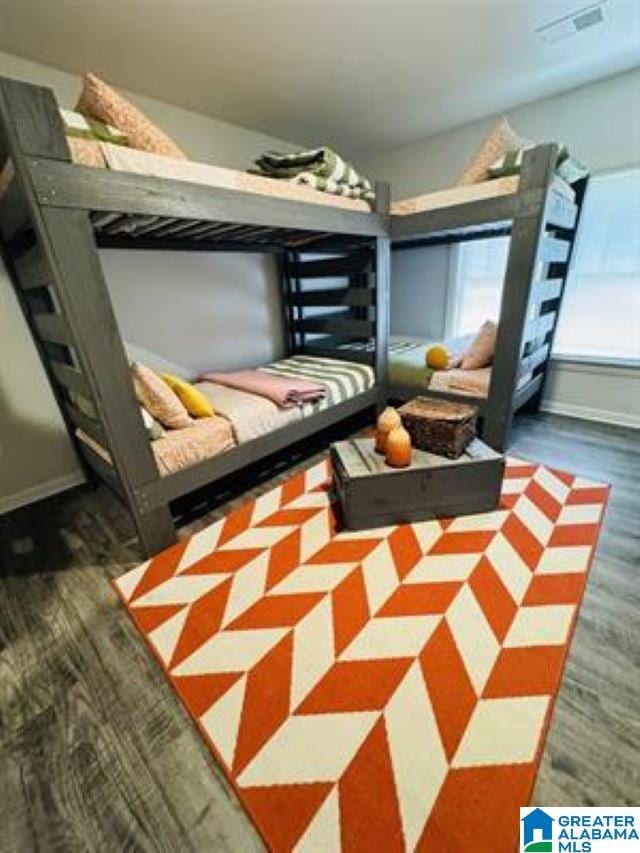 bedroom featuring dark wood-type flooring