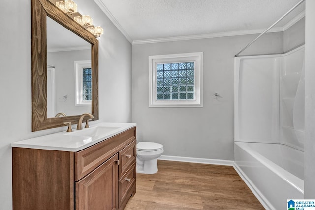 full bathroom with hardwood / wood-style floors, vanity, toilet, crown molding, and a textured ceiling