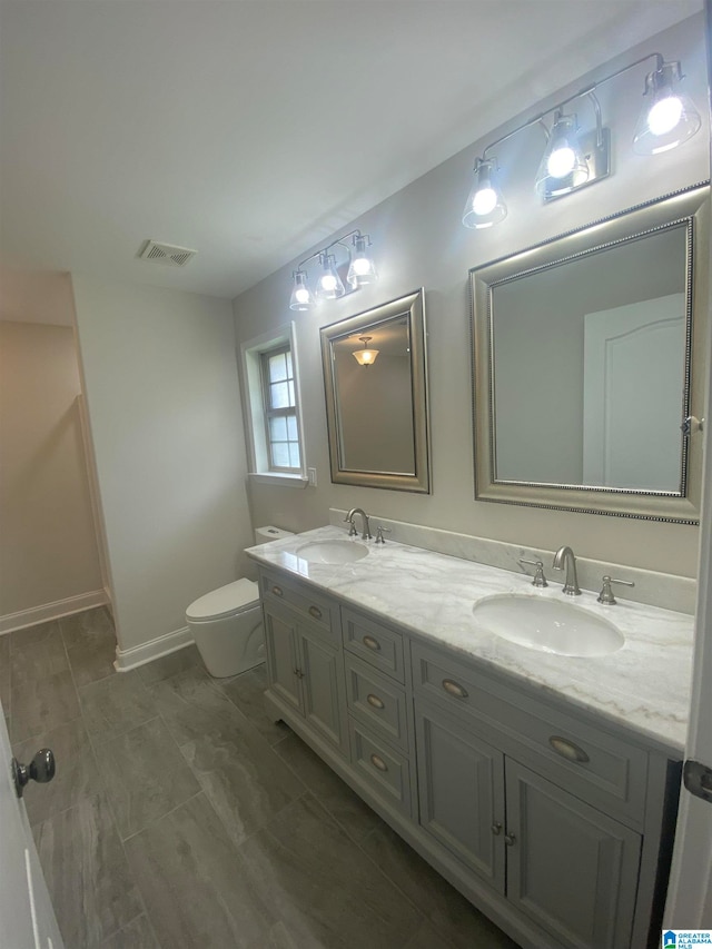 bathroom with vanity and toilet