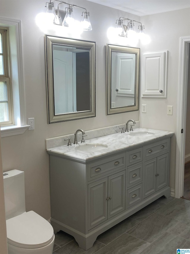 bathroom with vanity and toilet