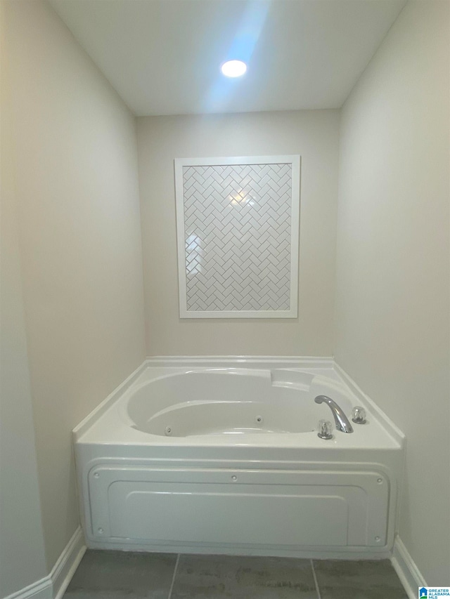 bathroom featuring a bath and tile patterned flooring